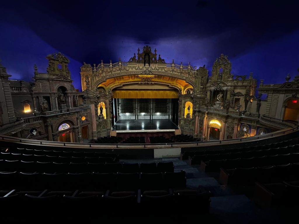 The gilded proscenium and stage of the Paradise Theater