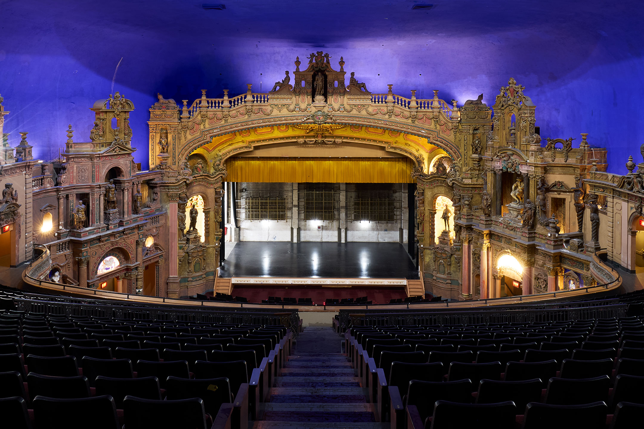The central seating rows face the richly decorated stage.